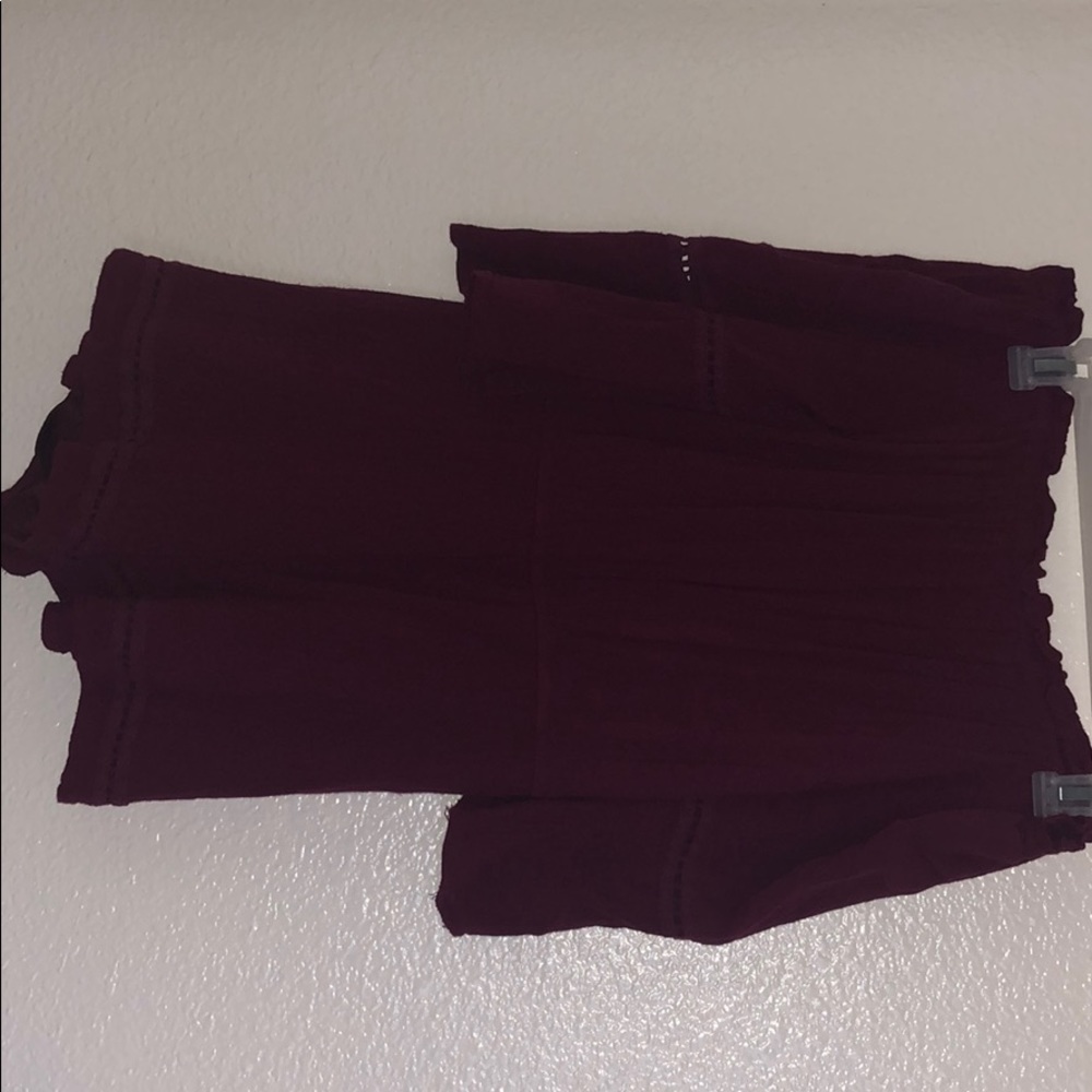 A maroon like colored romper